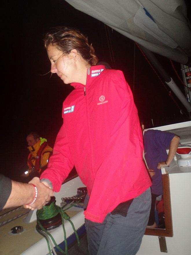 Michelle coming up on deck to be transferred to the transfer boat before proceeding into the harbor. © Jonathan Levy http://www.clipperroundtheworld.com